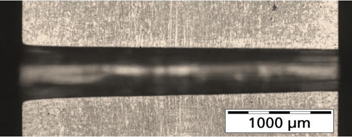 Figure 7. Longitudinal section of a drilled hole in 3 mm thick stainless steel without any recast layer