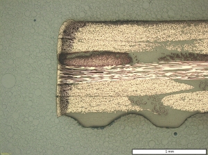 Figure 3. Cross-section of CFRP with laser wavelength-absorbing additives, cut at 5 kW laser power