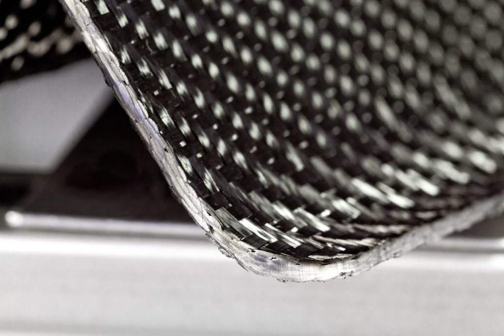 Carbon fiber reinforced plastics can be cut with the laser either before or after shaping. If desired, the pure carbon fiber mats can be cut prior to or after filling with the binding polymer.