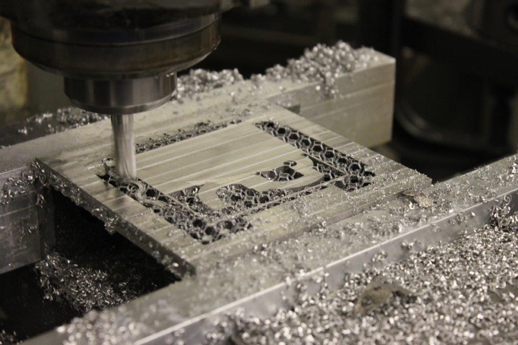 Precision machining a metal 3D printed component, part of the “Hybrid Manufacturing” approach.